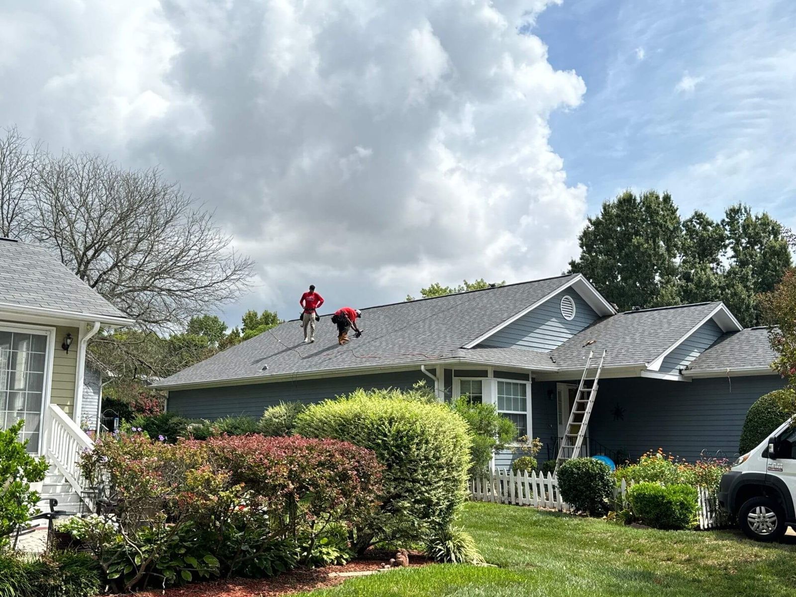 Stiles Roofing crew repairing a shingle roof