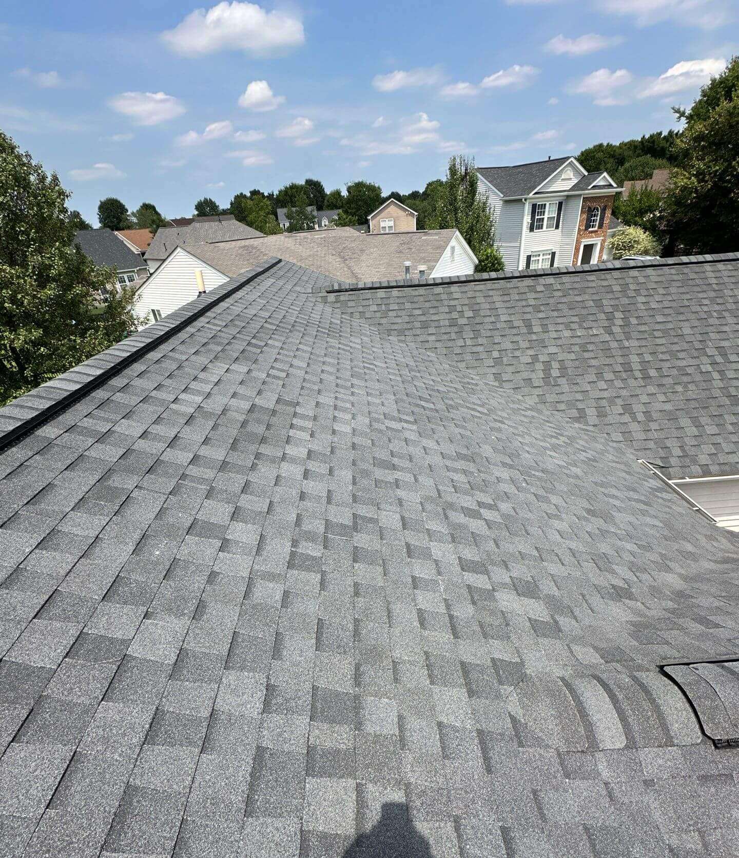Freshly installed architectural shingle roof by Stiles Roofing overlooking a Charlotte area neighborhood